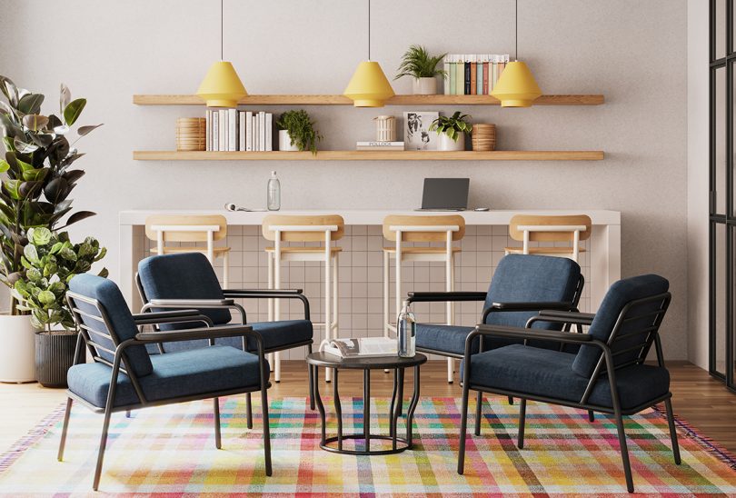 four indoor/outdoor armchairs around a coffee table in front of a kitchen island with stools