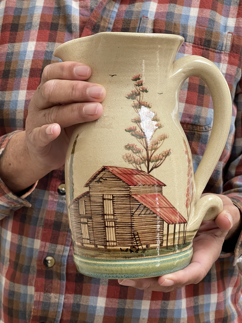 close up of hand painted water pitcher