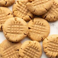 flourless peanut butter cookies scattered on a surface