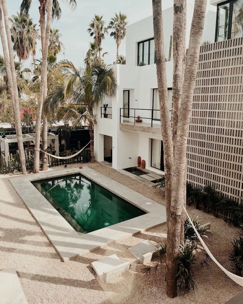 A courtyard with a pool situated at the center of the property