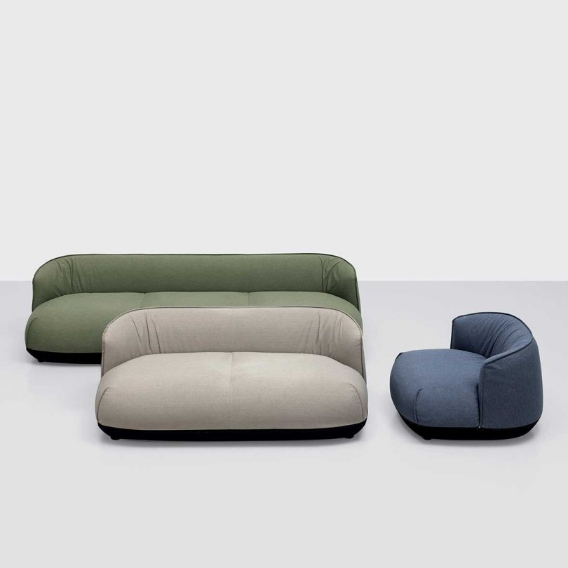 two outdoor sofas and outdoor seat in grey background