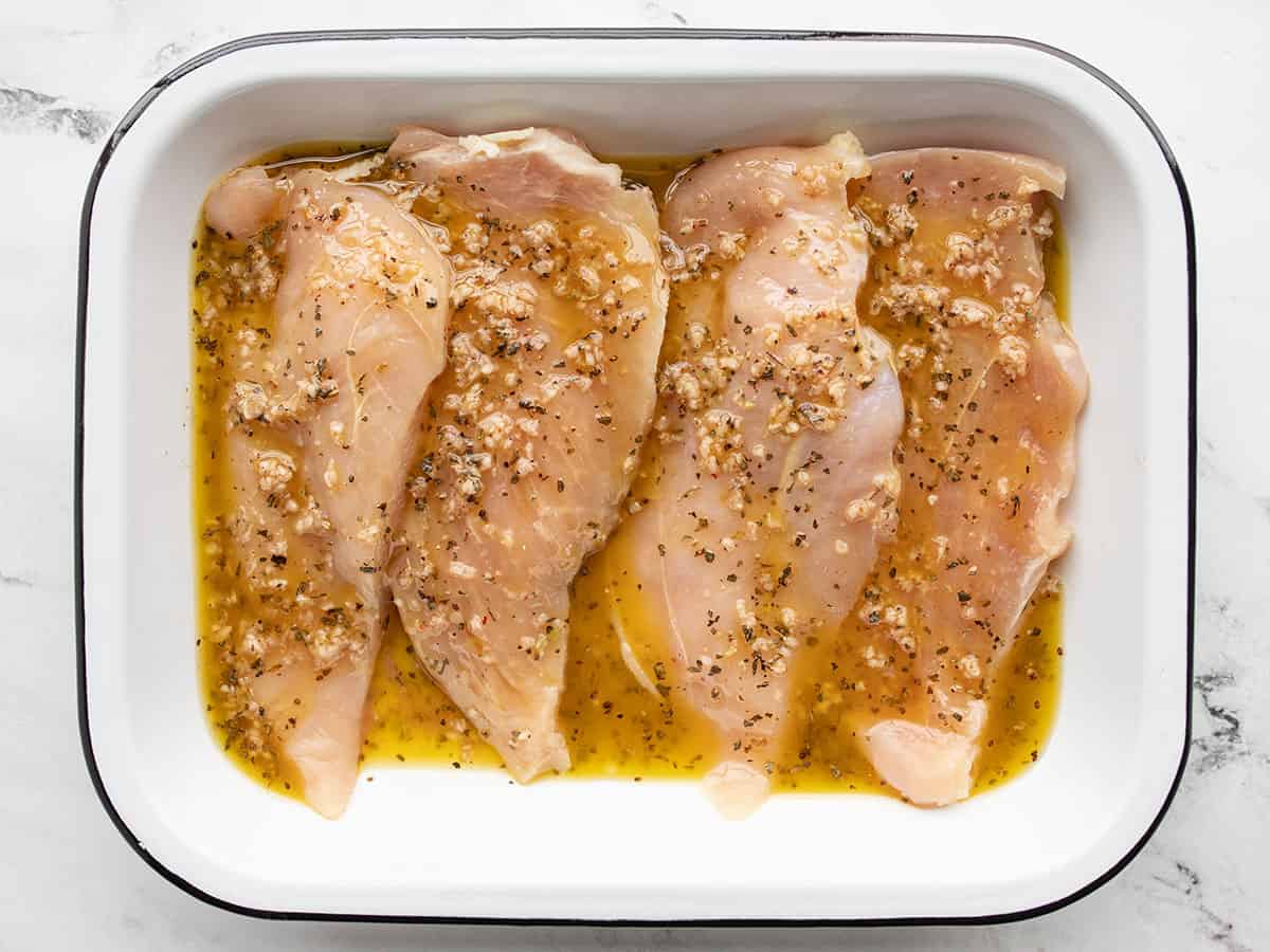 Marinating chicken in a shallow dish