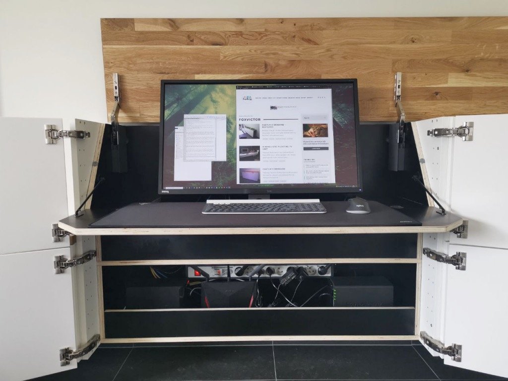 drop down desk with monitor and keyboard in hidden living home office