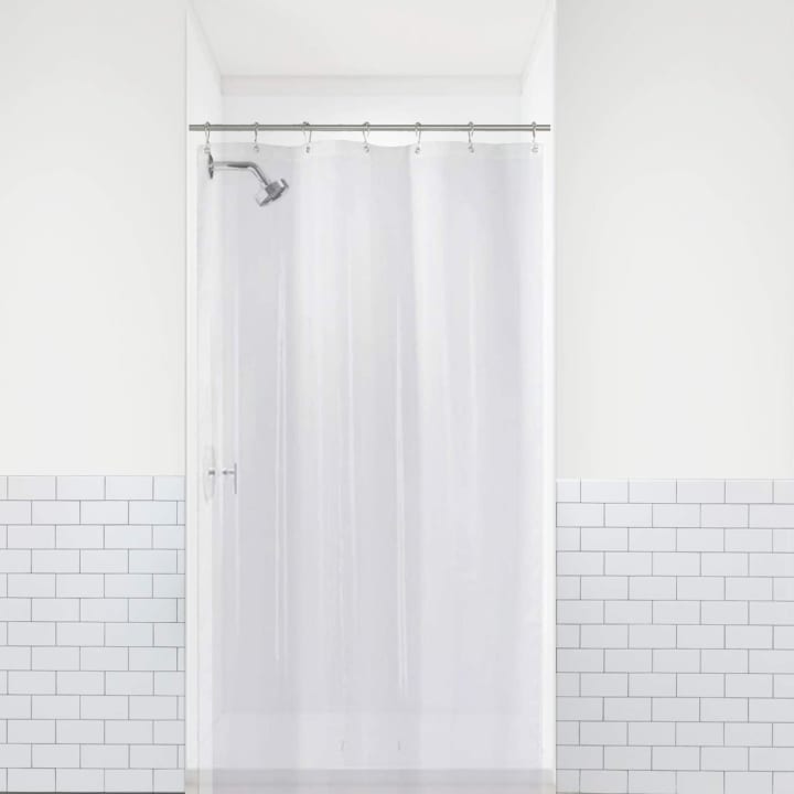 LiBa Shower Curtain Liner against brick shower facade.