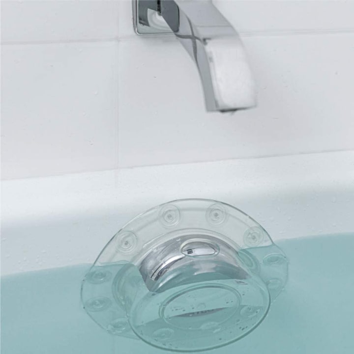 Gorilla Grip Bathtub Overflow Drain Cover with water rising slightly over the drain.