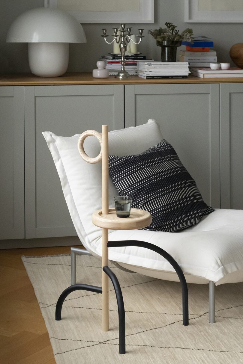 styled interior living space with chair and side table