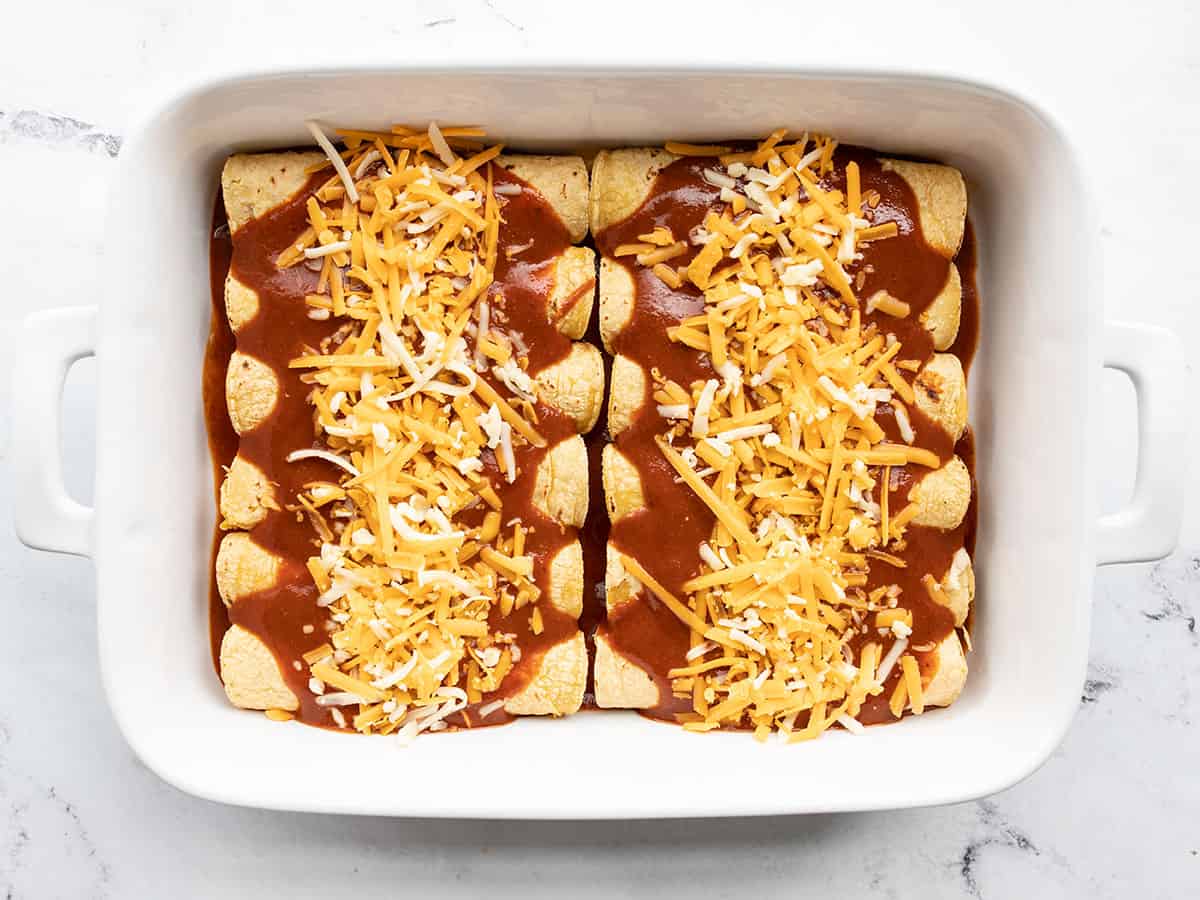 Enchiladas topped with the remaining shredded cheese.