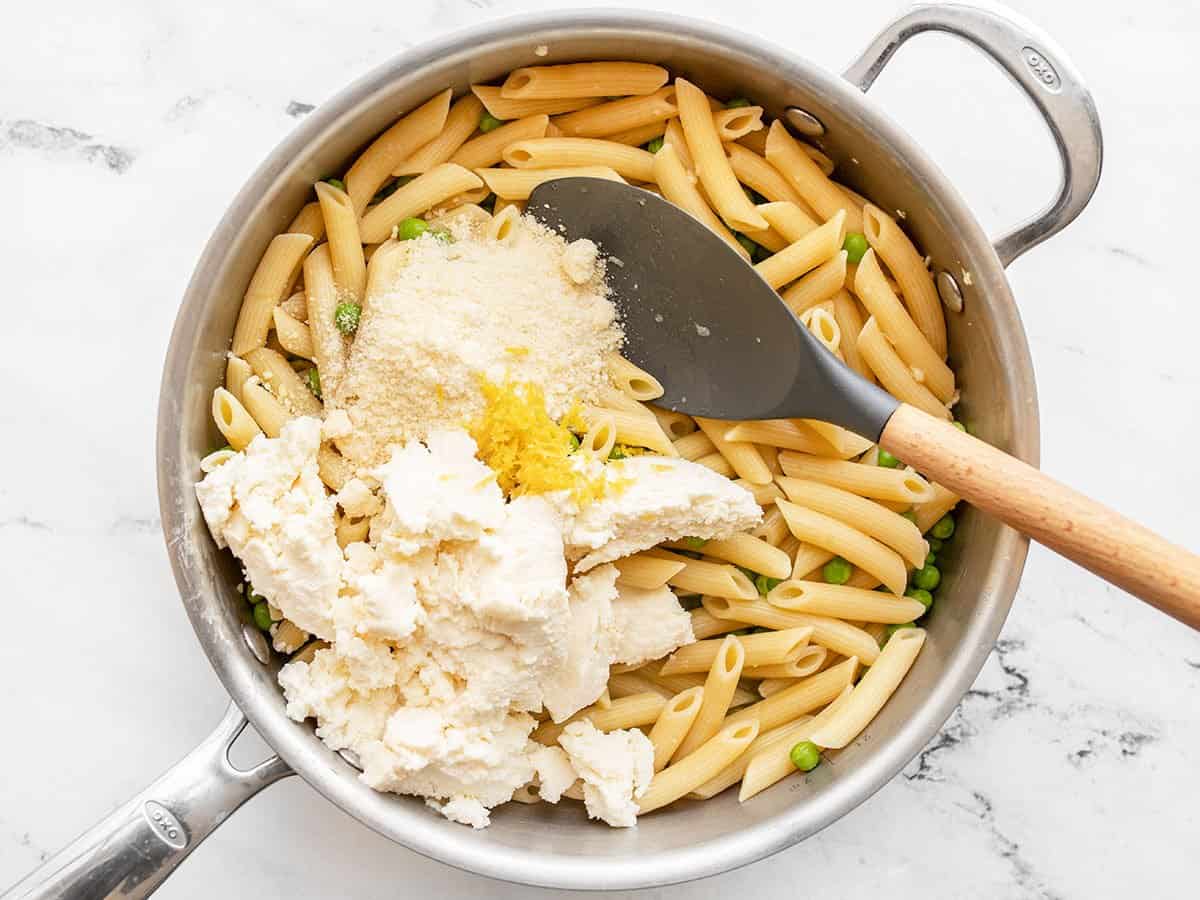 Cheese and lemon added to pasta.