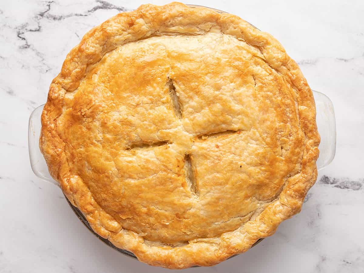 Overhead shot of a fully cooked pie with a golden-brown pastry.